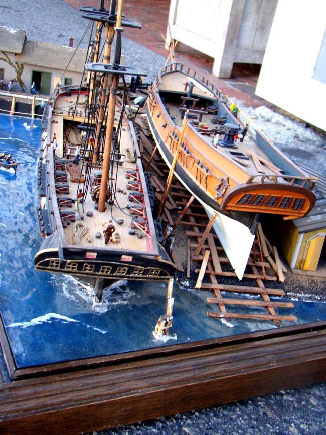 A fabulous and highly detailed scale model diorama circa 1920 of a New England Ship yard circa 1800-1812 making repairs on a 38 Gun American Frigate and a 10 Gun Privateer built circa 1785. — image 8